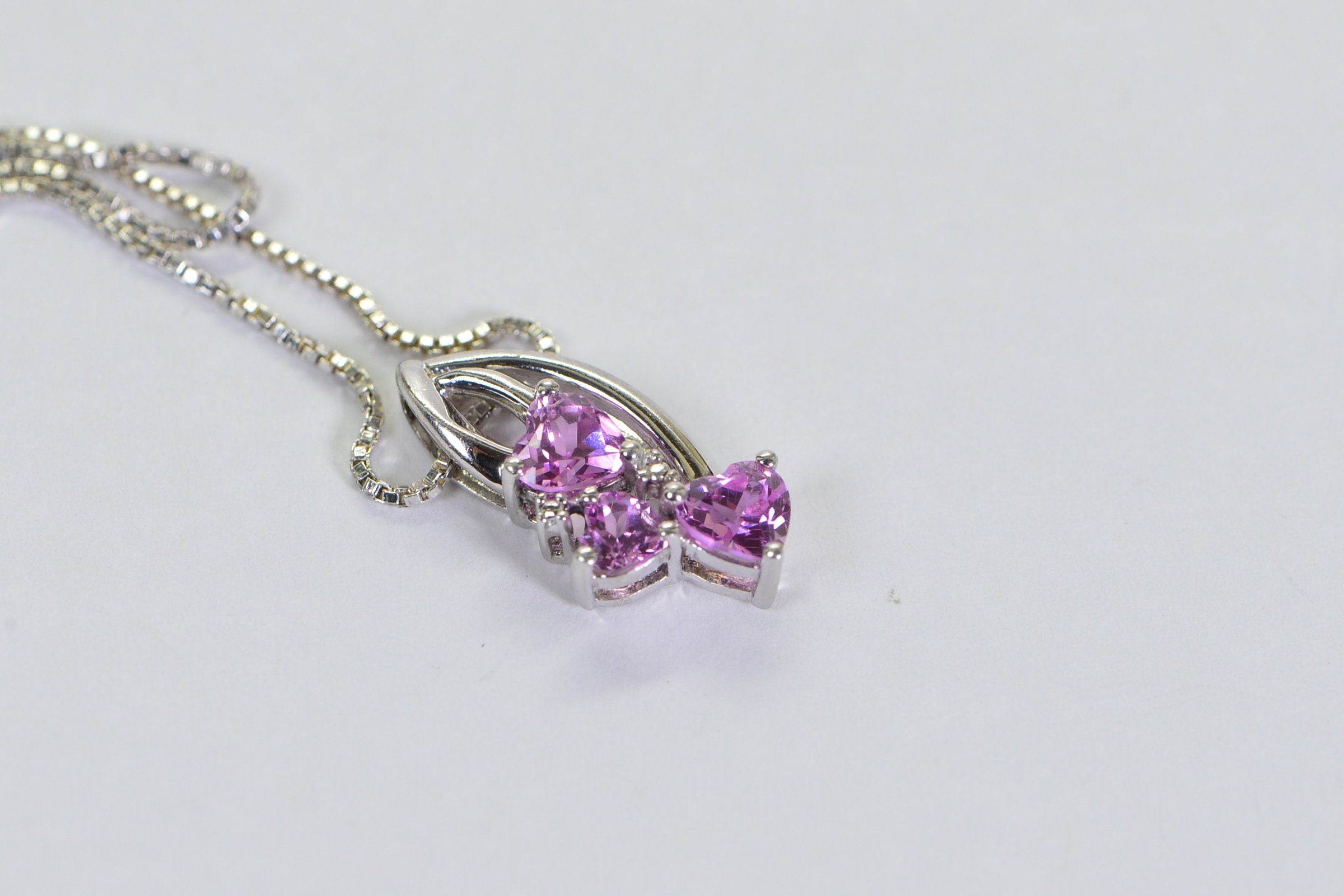 Pink Sapphire Three Hearts Pendant: Rhodium Sterling Silver Necklace