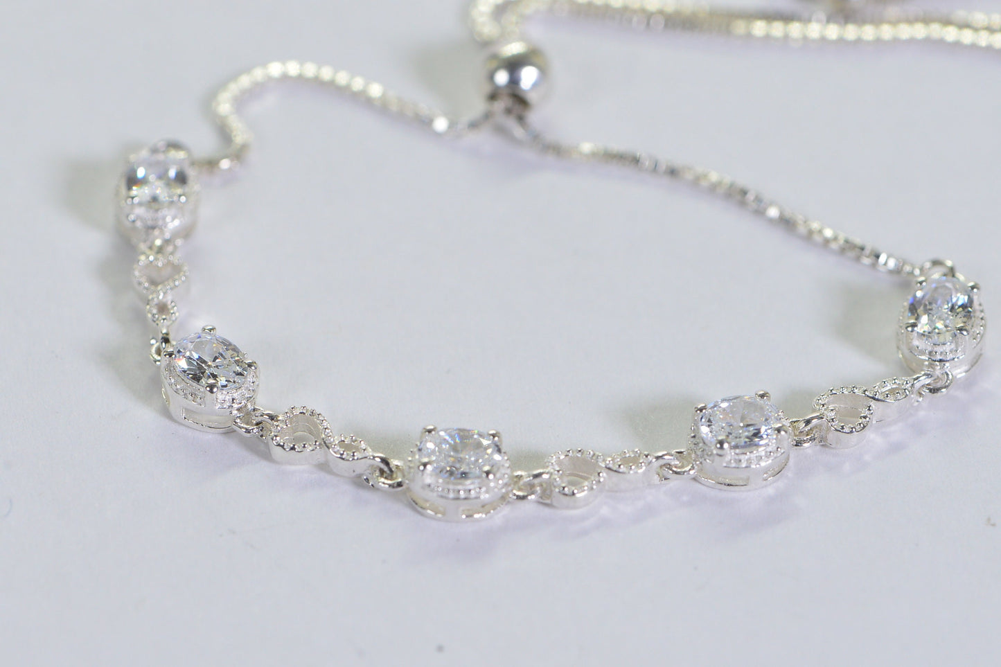 Simulated Diamond Tennis Bolo Bracelet: Rhodium Sterling Silver, Milgrain Infinity
