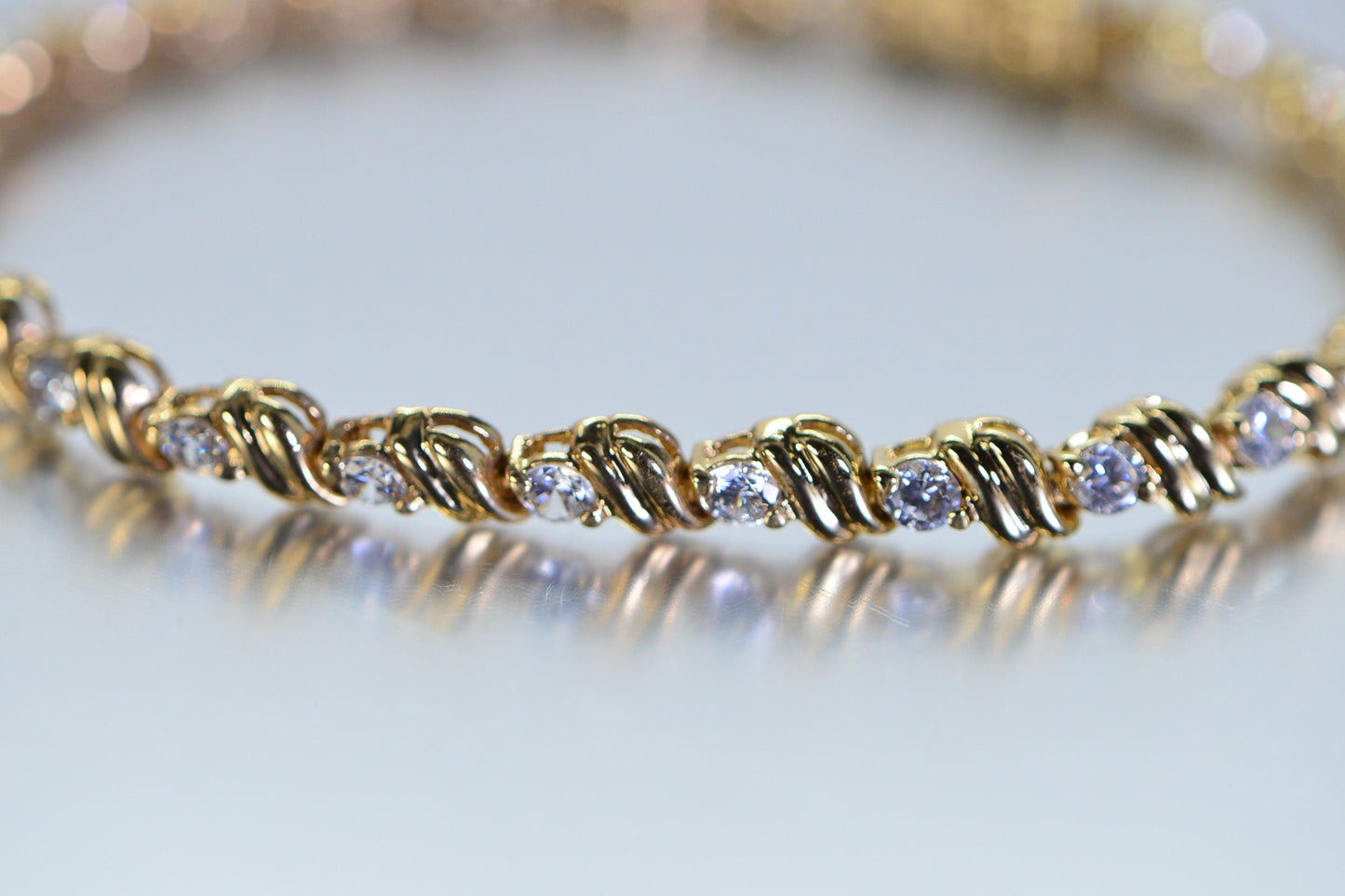 Simulated Diamond Tennis Bracelet: 18K Yellow Gold Over Sterling Silver