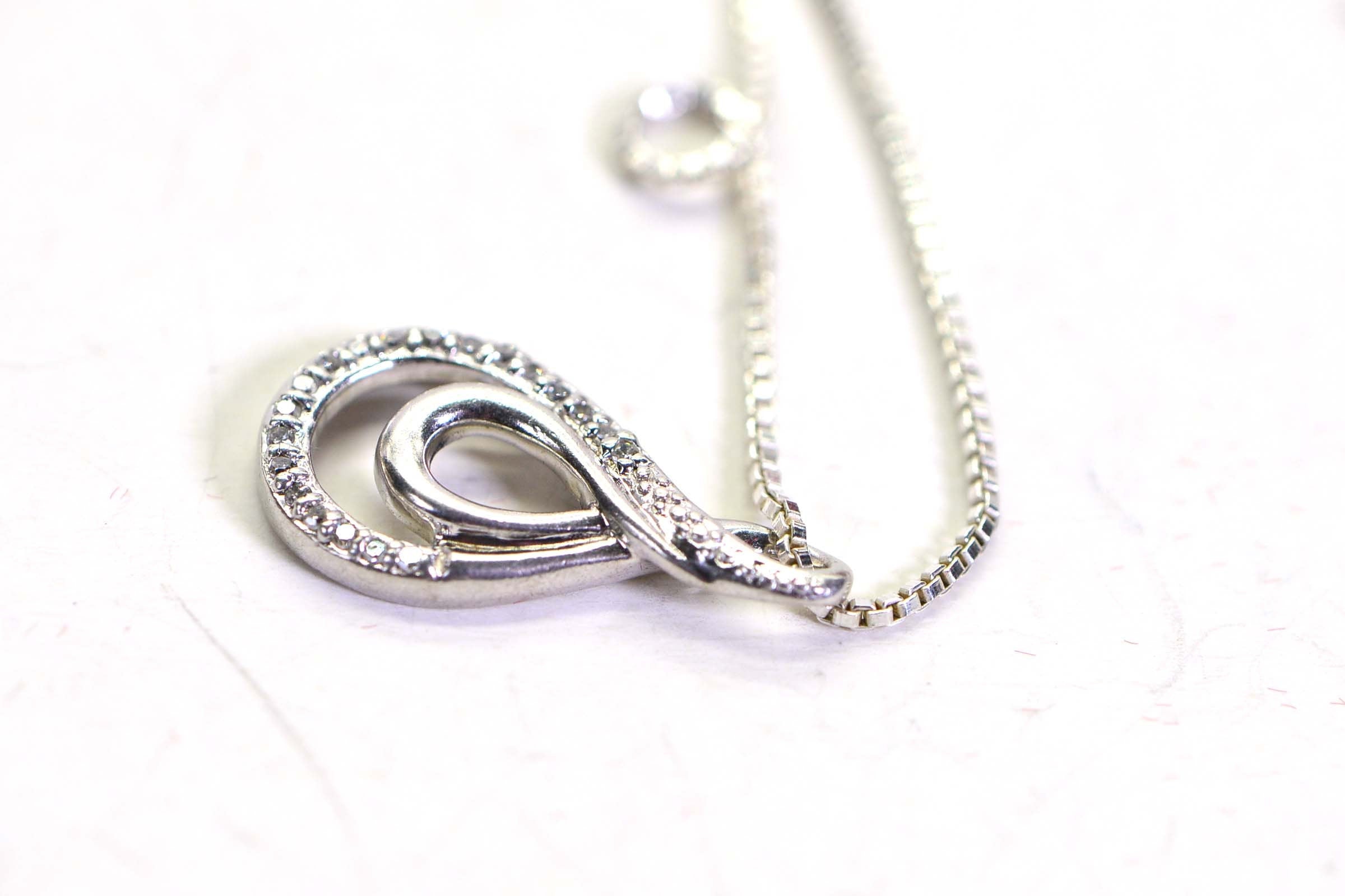 Vintage Diamond Swirl Pendant: Sterling Silver Infinity Loop