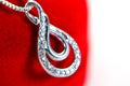 Vintage Diamond Swirl Pendant: Sterling Silver Infinity Loop