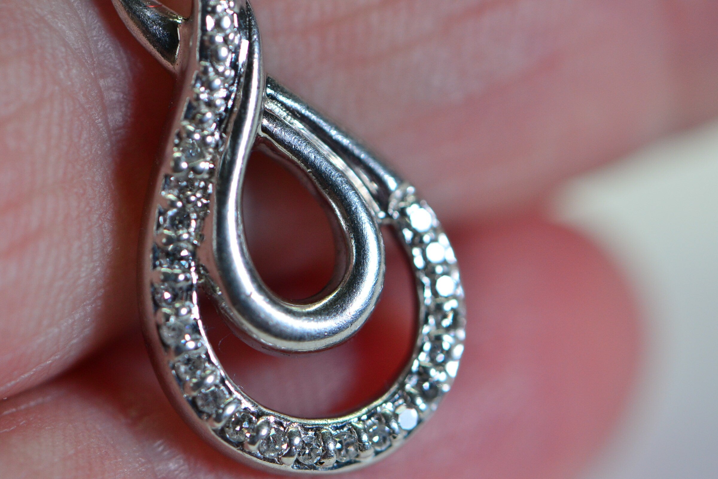 Vintage Diamond Swirl Pendant: Sterling Silver Infinity Loop
