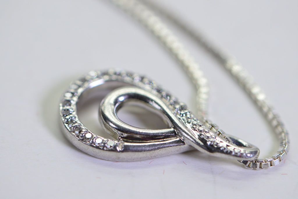 Vintage Diamond Swirl Pendant: Sterling Silver Infinity Loop