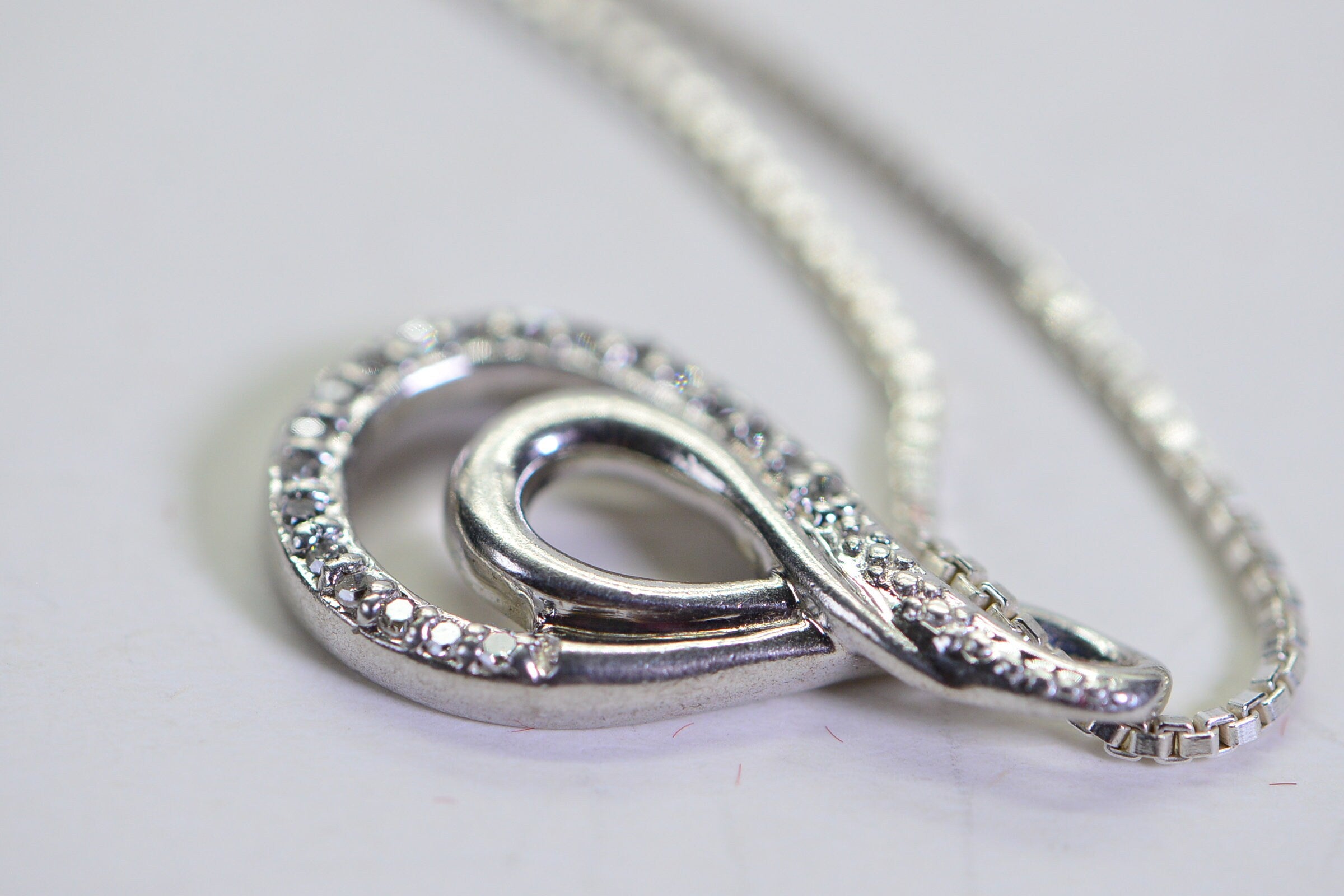 Vintage Diamond Swirl Pendant: Sterling Silver Infinity Loop