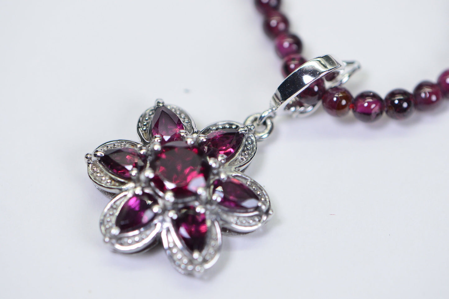 Garnet Flower Pendant: Rhodium Over Sterling Silver, January Birthstone