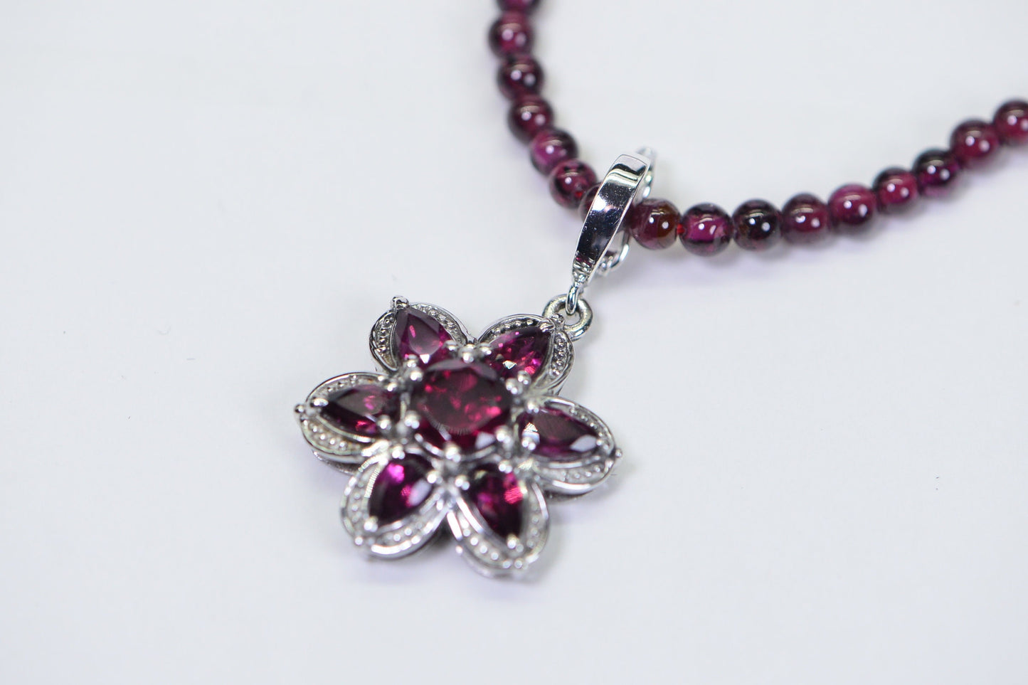 Garnet Flower Pendant: Rhodium Over Sterling Silver, January Birthstone