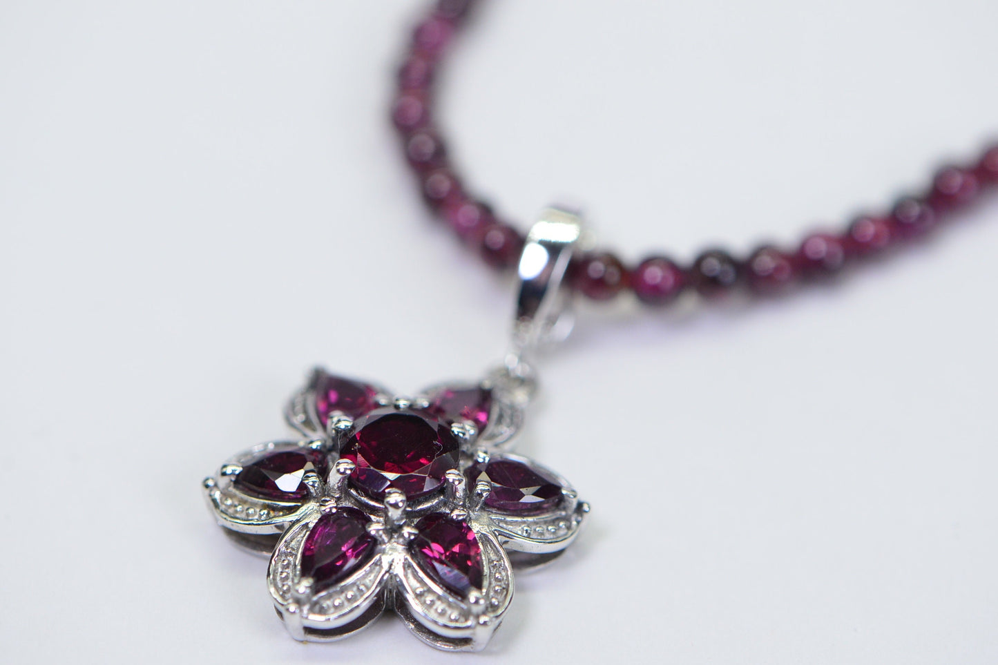 Garnet Flower Pendant: Rhodium Over Sterling Silver, January Birthstone