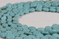 Dyed Magnesite Bead Strand: Greenish Blue Oval Cabochons