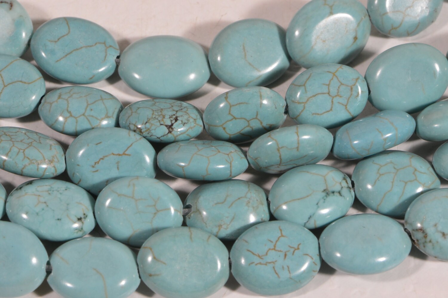 Dyed Magnesite Bead Strand: Greenish Blue Oval Cabochons