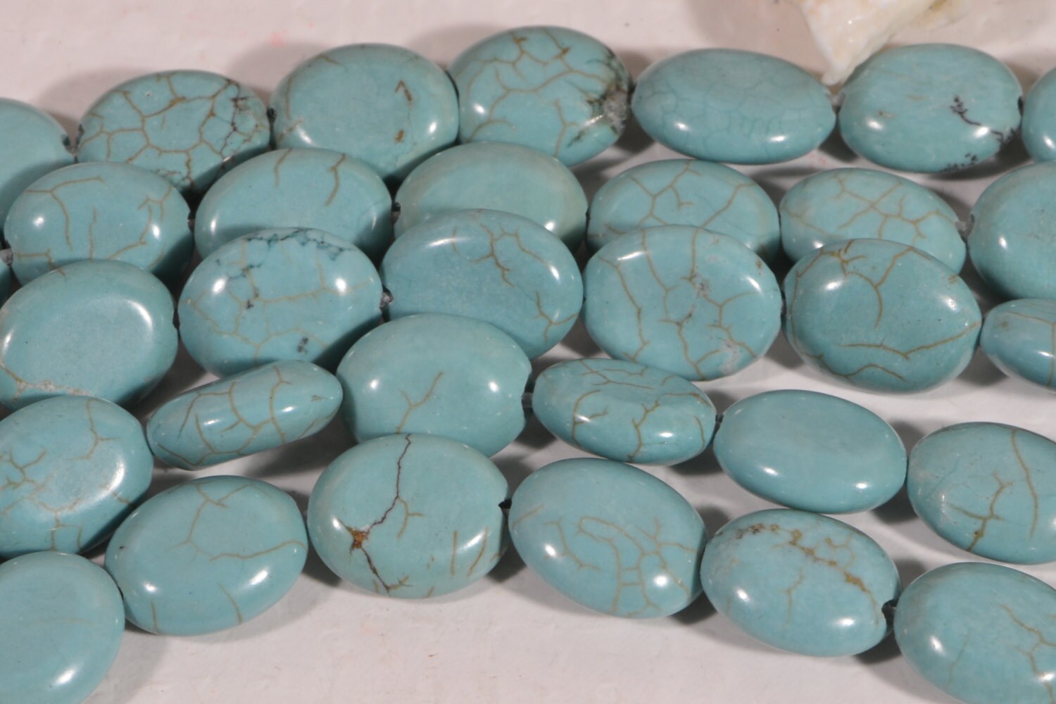 Dyed Magnesite Bead Strand: Greenish Blue Oval Cabochons