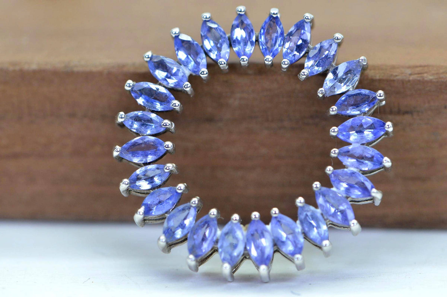 Tanzanite Circle Pendant Necklace: Sterling Silver Rhodium Finish, Floral Design
