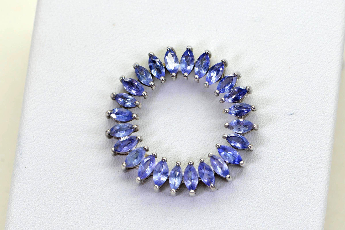 Tanzanite Circle Pendant Necklace: Sterling Silver Rhodium Finish, Floral Design