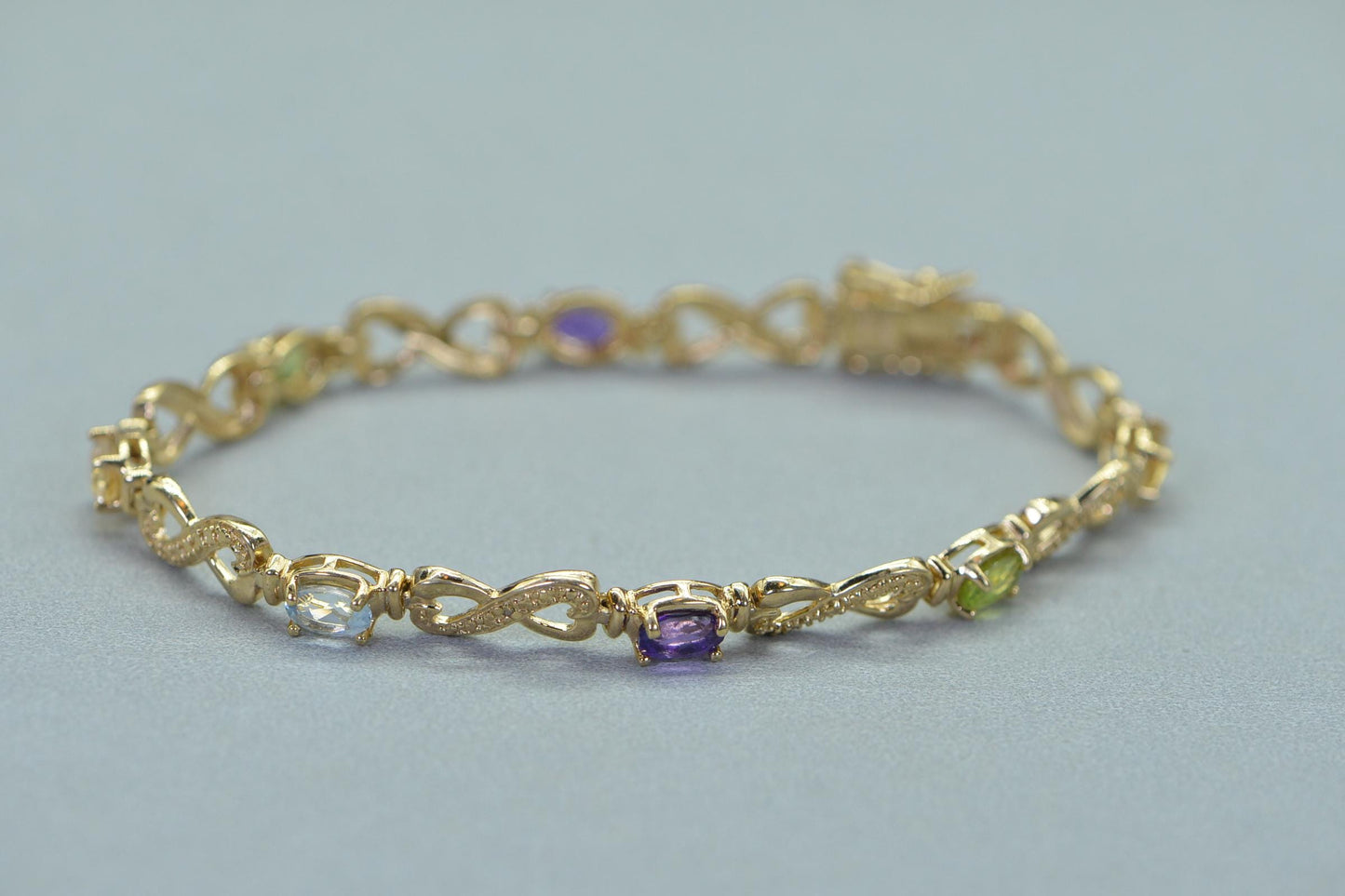Rainbow Gemstone Tennis Bracelet: 14k Gold over Sterling Silver Infinity Design