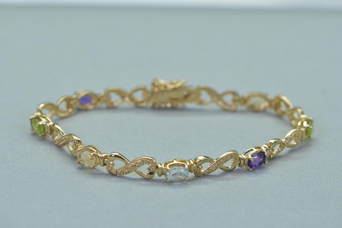 Rainbow Gemstone Tennis Bracelet: 14k Gold over Sterling Silver Infinity Design