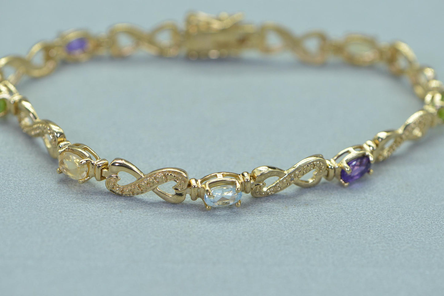 Rainbow Gemstone Tennis Bracelet: 14k Gold over Sterling Silver Infinity Design