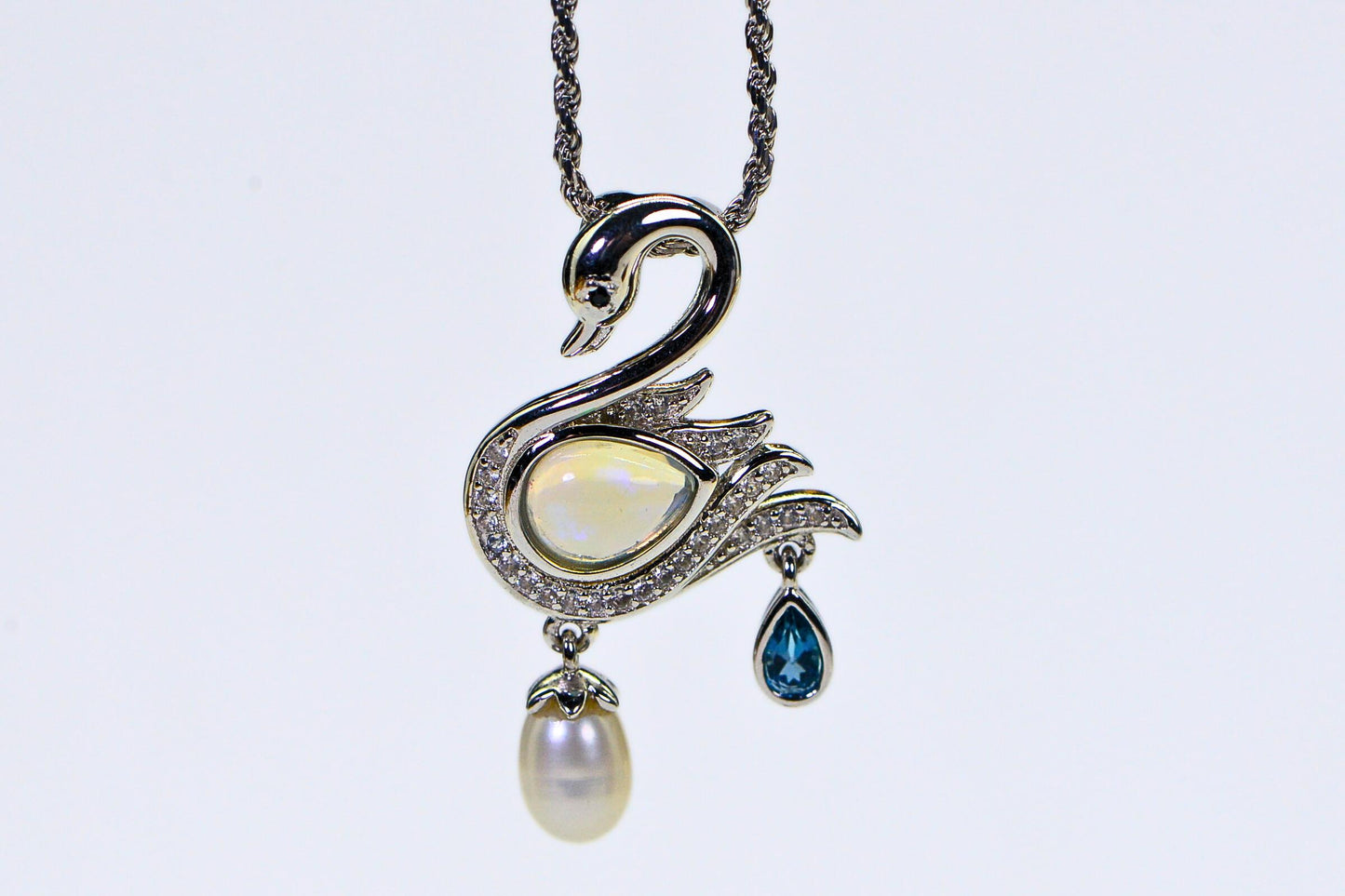 Welo Opal Swan Pendant: 14K White Gold Over Sterling Silver, Pearl & Topaz Accent