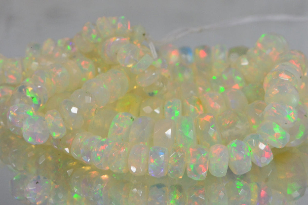 Ethiopian Opal Beads: 45.3ctw Faceted Rondelle Gemstone Strand