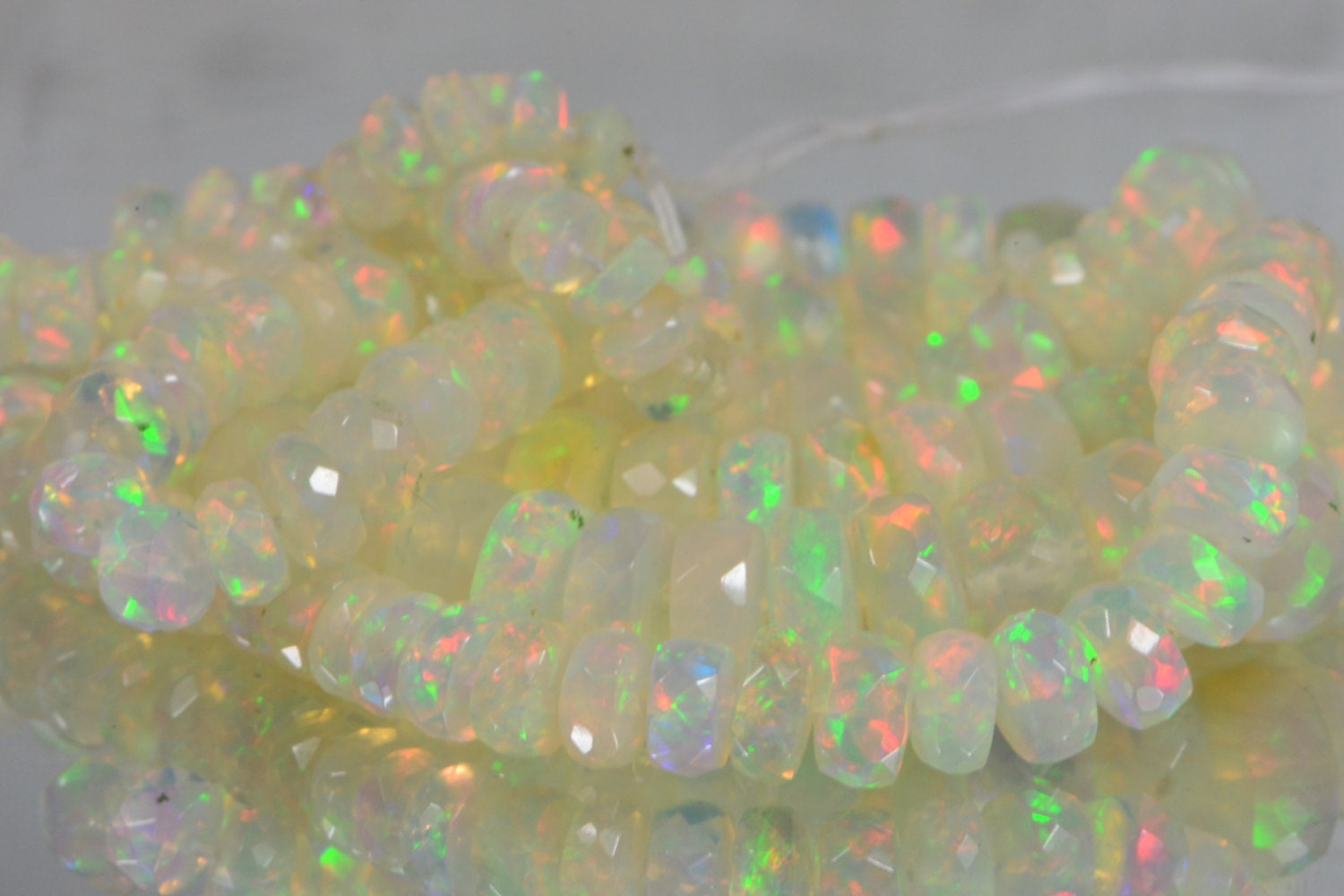 Ethiopian Opal Beads: 45.3ctw Faceted Rondelle Gemstone Strand