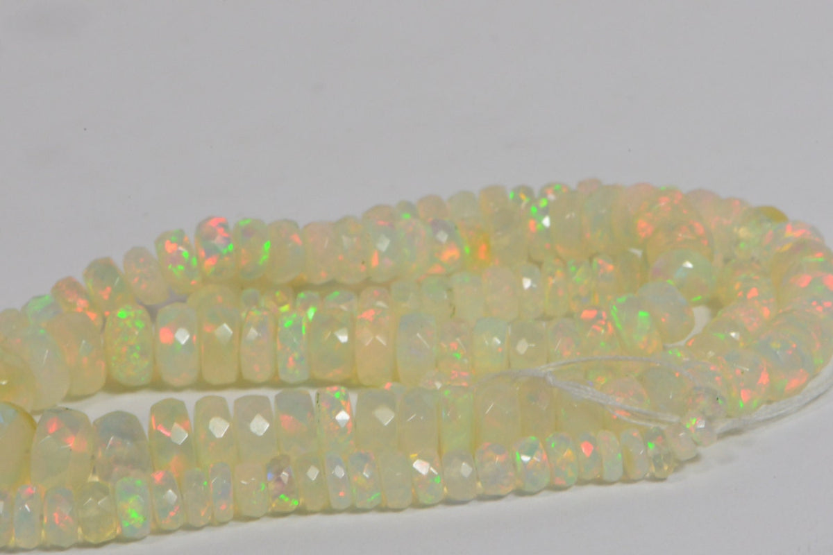 Ethiopian Opal Beads: 45.3ctw Faceted Rondelle Gemstone Strand