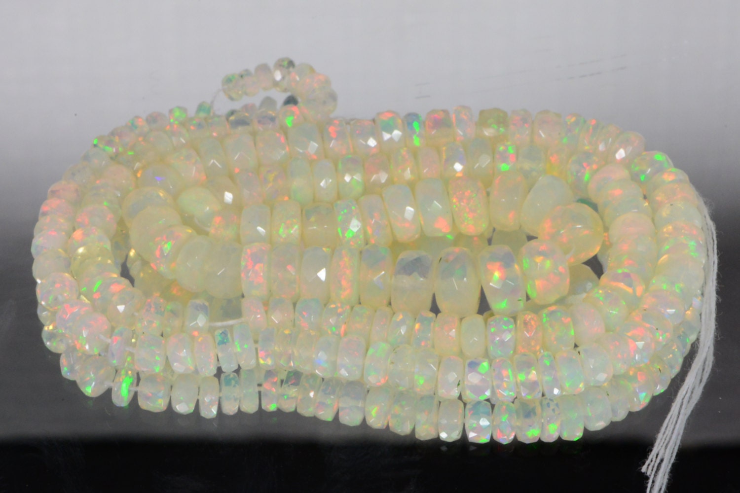 Ethiopian Opal Beads: 45.3ctw Faceted Rondelle Gemstone Strand