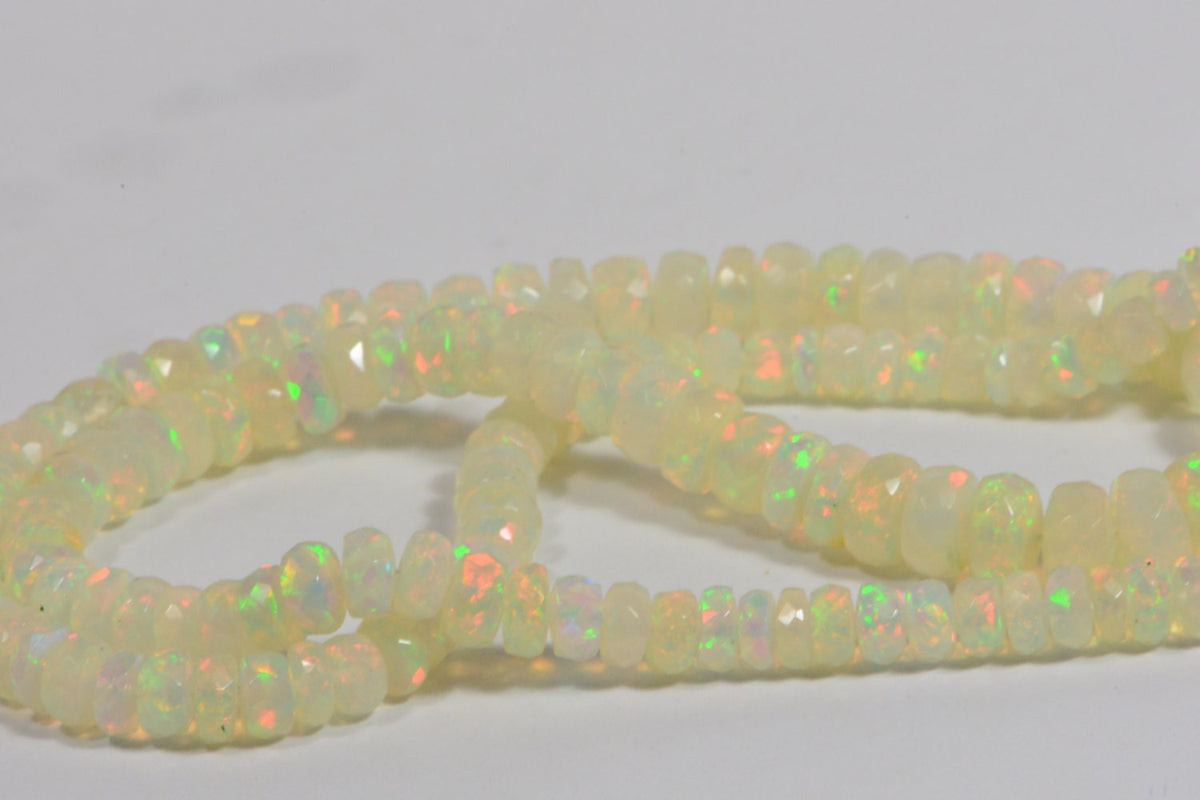 Ethiopian Opal Beads: 45.3ctw Faceted Rondelle Gemstone Strand