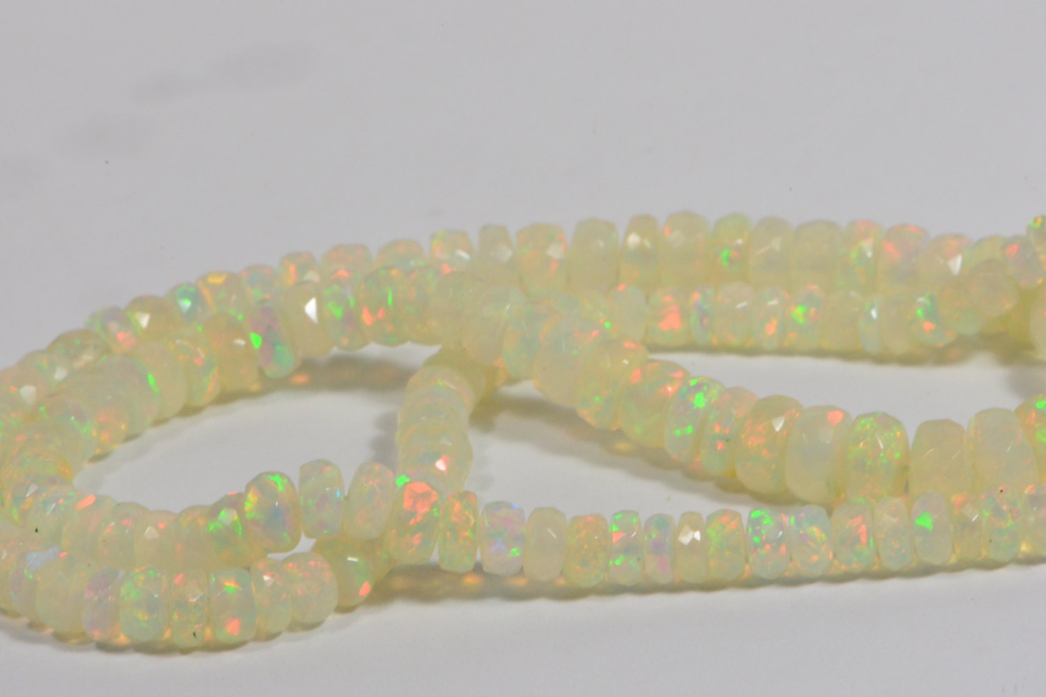 Ethiopian Opal Beads: 45.3ctw Faceted Rondelle Gemstone Strand
