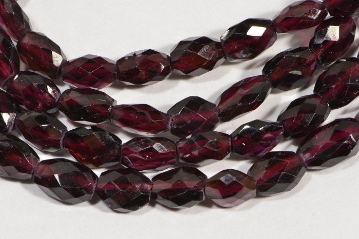 Faceted Garnet Gemstone Beads: Burgundy Red Oval, 7.5" Strand