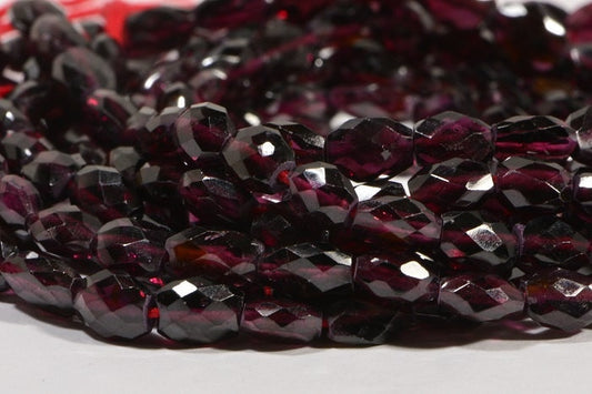 Faceted Garnet Gemstone Beads: Burgundy Red Oval, 7.5" Strand