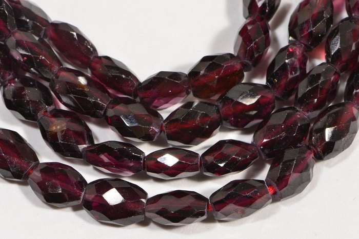 Faceted Garnet Gemstone Beads: Burgundy Red Oval, 7.5" Strand